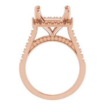Rose gold engagement ring setting with square stone head, decorative accents on shoulders, and textured bands.