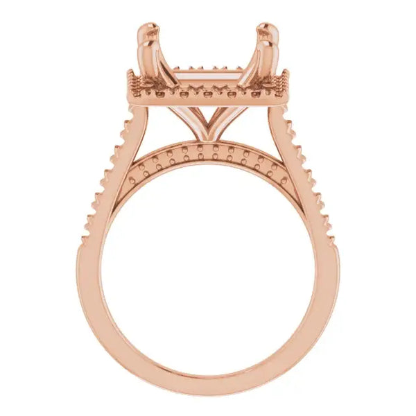 Rose gold engagement ring setting with square stone head, decorative accents on shoulders, and textured bands.