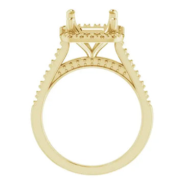 Yellow gold engagement ring setting with decorative prongs and small accent stones along the band.