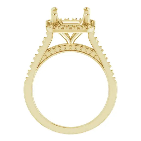 Yellow gold engagement ring setting with decorative prongs and small accent stones along the band.