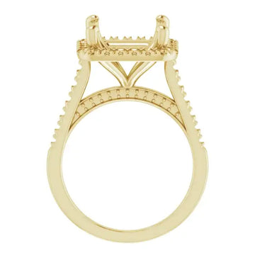 Yellow gold engagement ring setting with decorative accents on the band and rectangular stone holder.