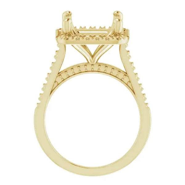 Yellow gold engagement ring setting with decorative accents on the band and rectangular stone holder.