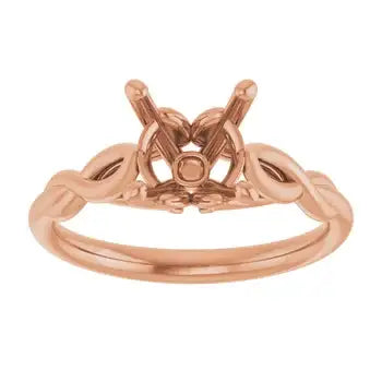 Rose gold solitaire engagement ring setting with empty round stone seat and curved band.