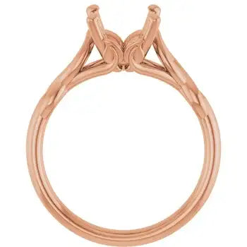 Rose gold solitaire engagement ring setting with oval stone prongs and textured band.
