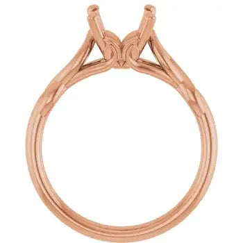 Rose gold solitaire engagement ring setting with four-prong head and textured band, shown without center stone.