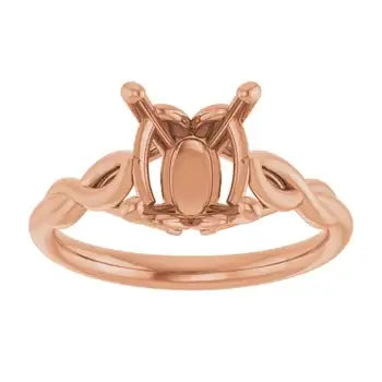 Rose gold solitaire engagement ring setting with oval stone holder and decorative side details.