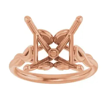 Rose gold solitaire engagement ring setting with open-work square stone mount and decorative side details.