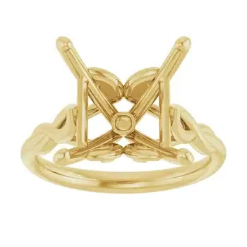 Gold solitaire engagement ring setting with square stone mount and decorative side details.