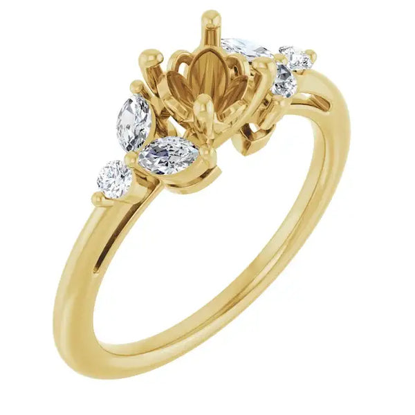 Gold engagement ring setting with ornate center crown and oval and round diamond accents on band.