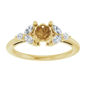 Yellow gold engagement ring setting with round diamond accents on either side of center stone seat.