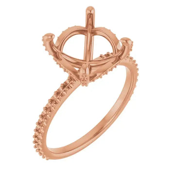 Rose gold engagement ring setting with hidden halo design and diamond-accented band for round center stone.