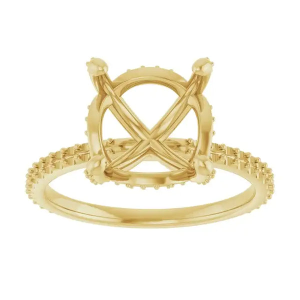 Gold ring setting with crossover band, textured halo design, and vacant round stone mount.
