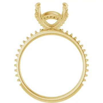 Gold engagement ring setting with hidden halo design and decorative prongs around the band.