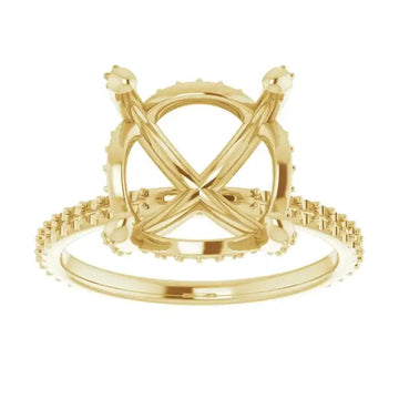 Gold engagement ring setting with crossed halo band and cushion stone mounting, shown from front view.