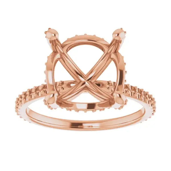 Rose gold engagement ring setting with crossed halo band and cushion stone holder, shown from front view.