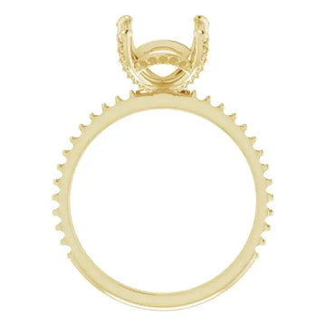 Yellow gold engagement ring setting with hidden halo design and prong head for emerald stone.