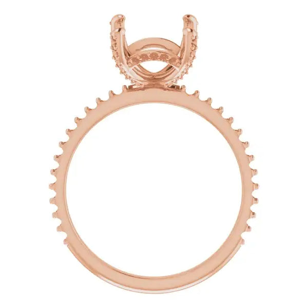 Rose gold engagement ring setting with hidden halo design and decorative prong band for emerald stone.