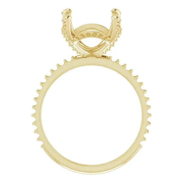 Gold engagement ring setting with hidden halo design and decorative prongs around the band for cushion-cut stones.
