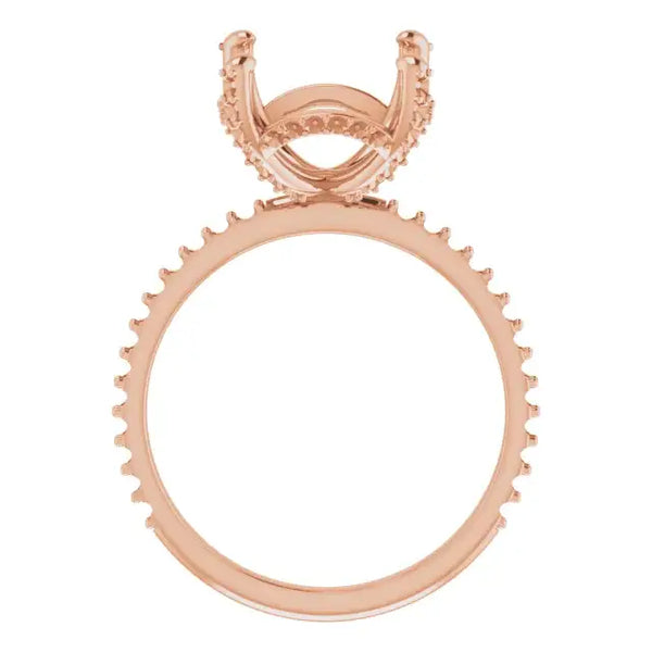 Rose gold engagement ring setting with hidden halo design and decorative prongs around the band.