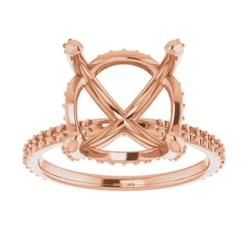 Rose gold engagement ring setting with crossed halo arms and accent stones on band, sized for asscher cut stones.
