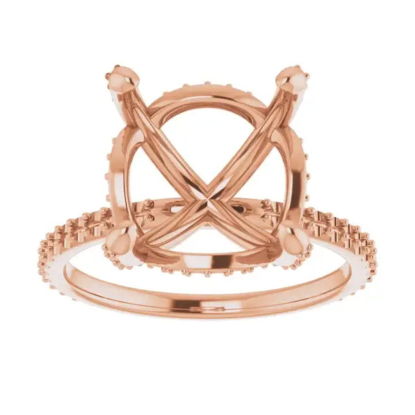 Rose gold engagement ring setting with crossed halo arms and accent stones on band, sized for asscher cut stones.