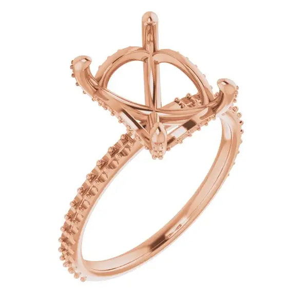 Rose gold engagement ring setting with hidden halo and pave diamond band, sized for emerald stones.