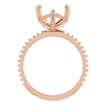 Rose gold engagement ring setting with hidden halo design and heart-shaped stone holder, shown from above.