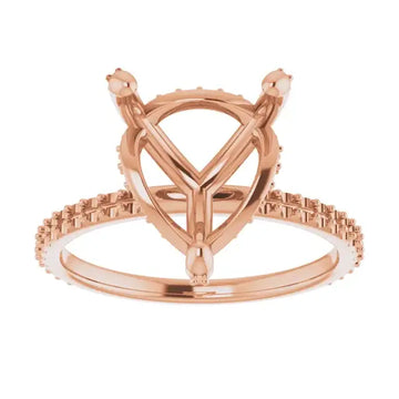 Rose gold engagement ring setting with heart-shaped center stone and hidden halo accent stones on band.