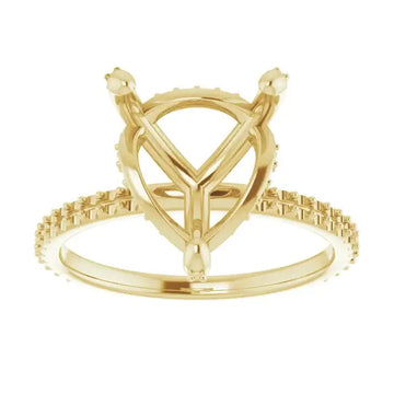 Gold engagement ring setting with heart-shaped center stone mount and small diamonds along the band.