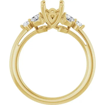 Gold engagement ring setting with open center prong mount and round diamond accents on sides.