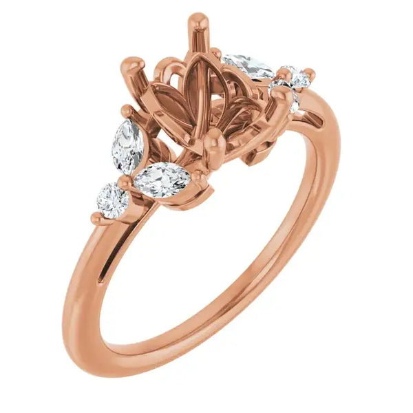 Rose gold engagement ring setting with ornate crown-shaped center stone holder and oval accent diamonds on band.