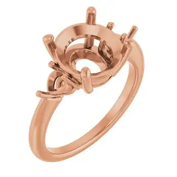Rose gold engagement ring setting with round stone cup and decorative side prongs.
