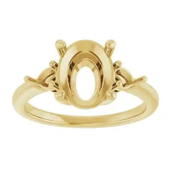 Gold engagement ring setting with oval stone gallery and decorative side accents.
