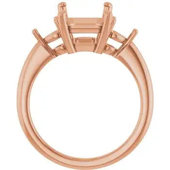 Rose gold engagement ring setting with eight prongs and emerald cut stone holder, shown from side view.