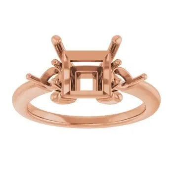 Rose gold engagement ring setting with ornate square stone holder and decorative side accents.
