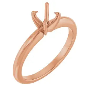 Rose gold solitaire ring setting with four-prong basket for round stones.