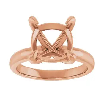 Rose gold solitaire engagement ring setting with cushion-cut stone holder and crossed prong design.