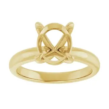 Gold solitaire engagement ring setting with oval stone cup and crossed prongs.