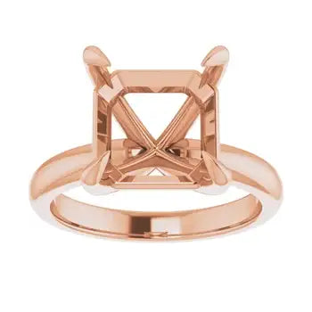 Rose gold solitaire engagement ring setting with square asscher cut stone holder and decorative prongs.