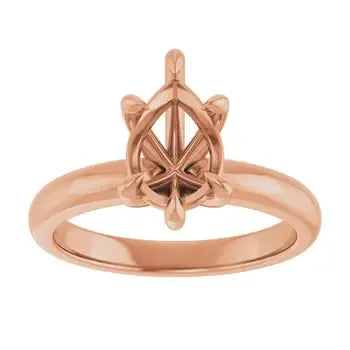 Rose gold solitaire engagement ring setting with pear-shaped stone holder and geometric prong design.