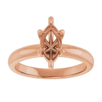 Rose gold solitaire engagement ring setting with ornate marquise stone holder and polished band.