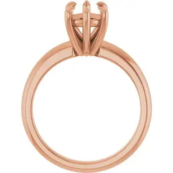 Rose gold solitaire ring setting with four-prong pear-shaped stone holder, shown from side angle.