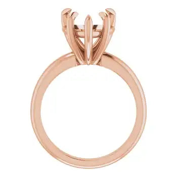 Rose gold solitaire engagement ring setting with four-prong heart stone holder, shown from above.