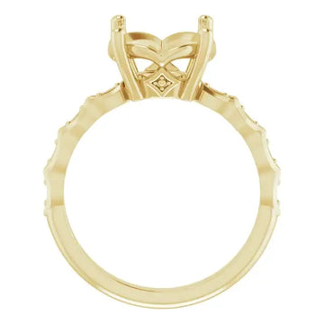 Gold engagement ring setting with ornate butterfly-shaped head and diamond accents along the band.