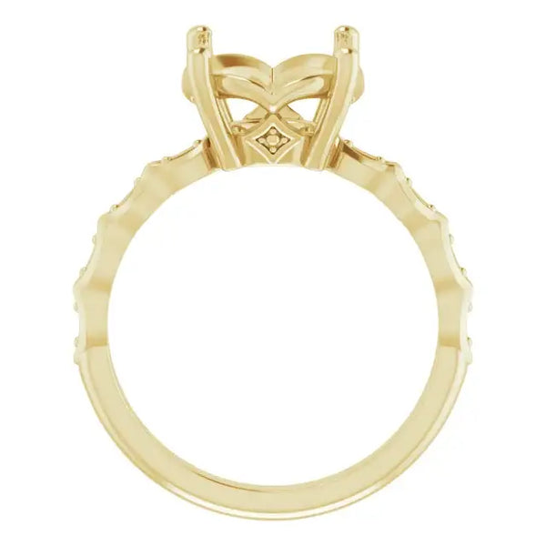 Gold engagement ring setting with ornate butterfly-shaped head and diamond accents along the band.