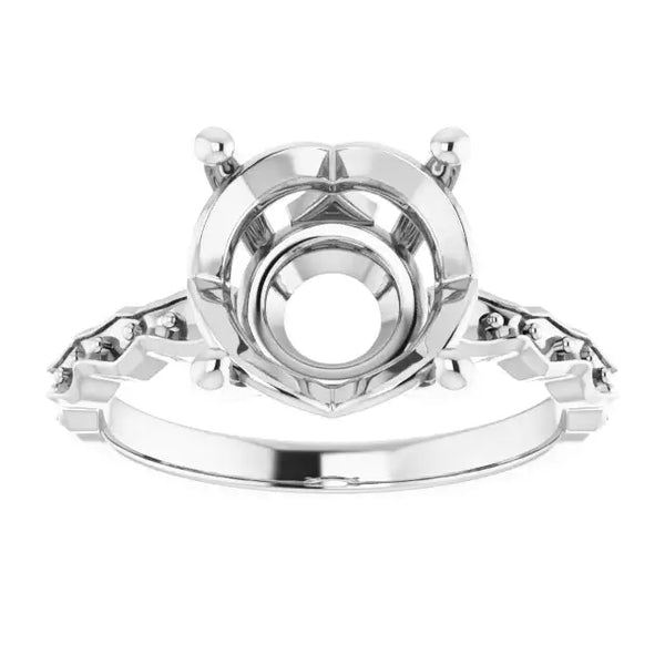 White gold engagement ring setting with French-set side stones and empty round center setting.