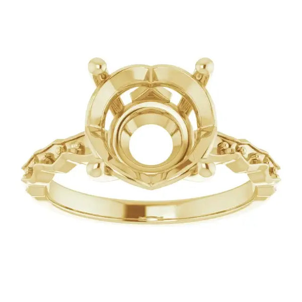 Yellow gold engagement ring setting with French-set accent stones and decorative crown-style head for round stone.