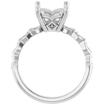 White metal engagement ring setting with ornate four-prong head and textured band, sized for emerald stone.