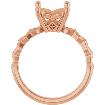 Rose gold engagement ring setting with French-set diamonds along band and geometric prong head for emerald stone.