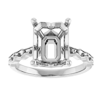 White metal engagement ring setting with French-set diamonds flanking an empty emerald-cut stone center.